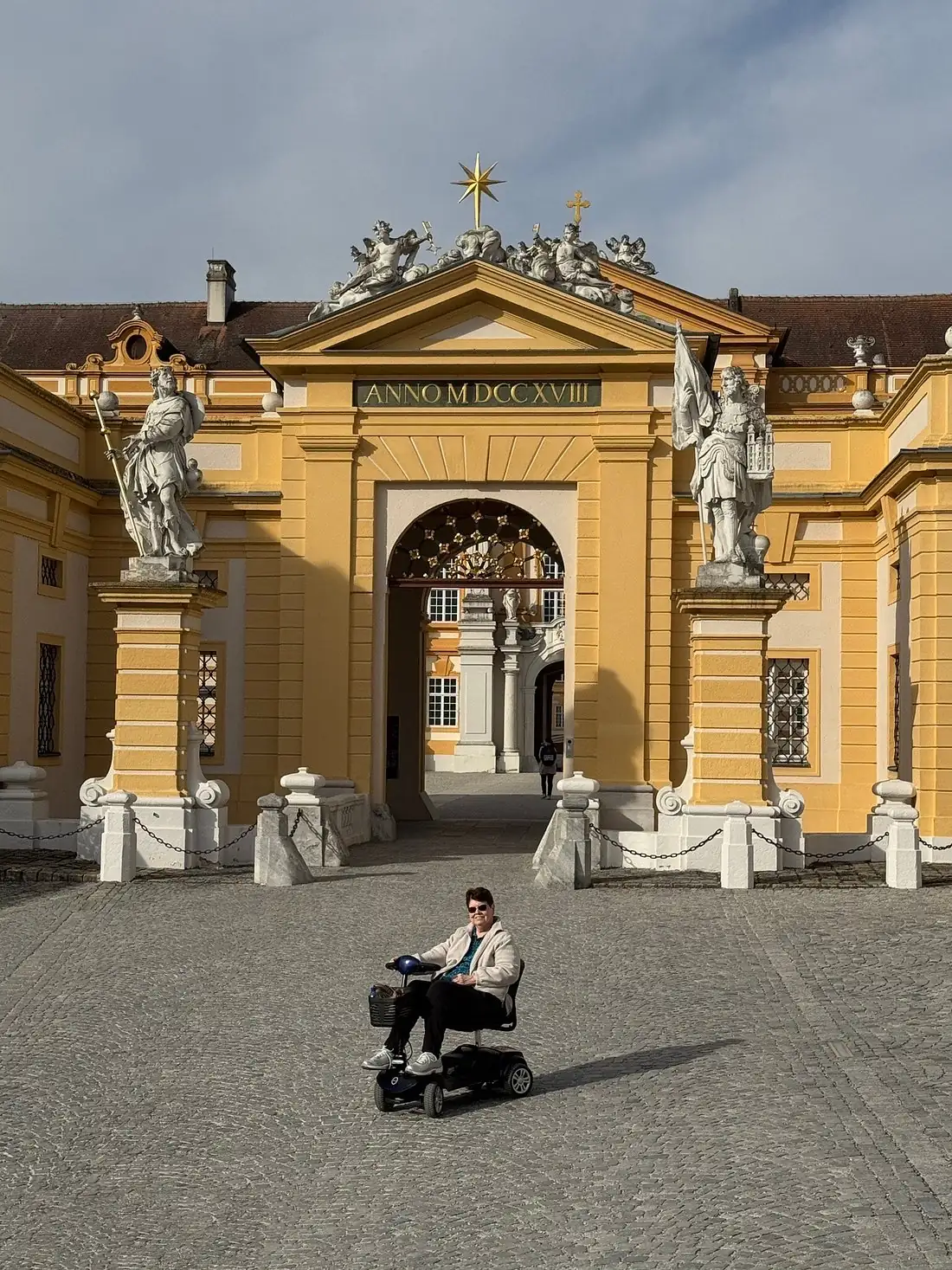 Mobile4Ever customer on a mobility scooter at Melk Abbey