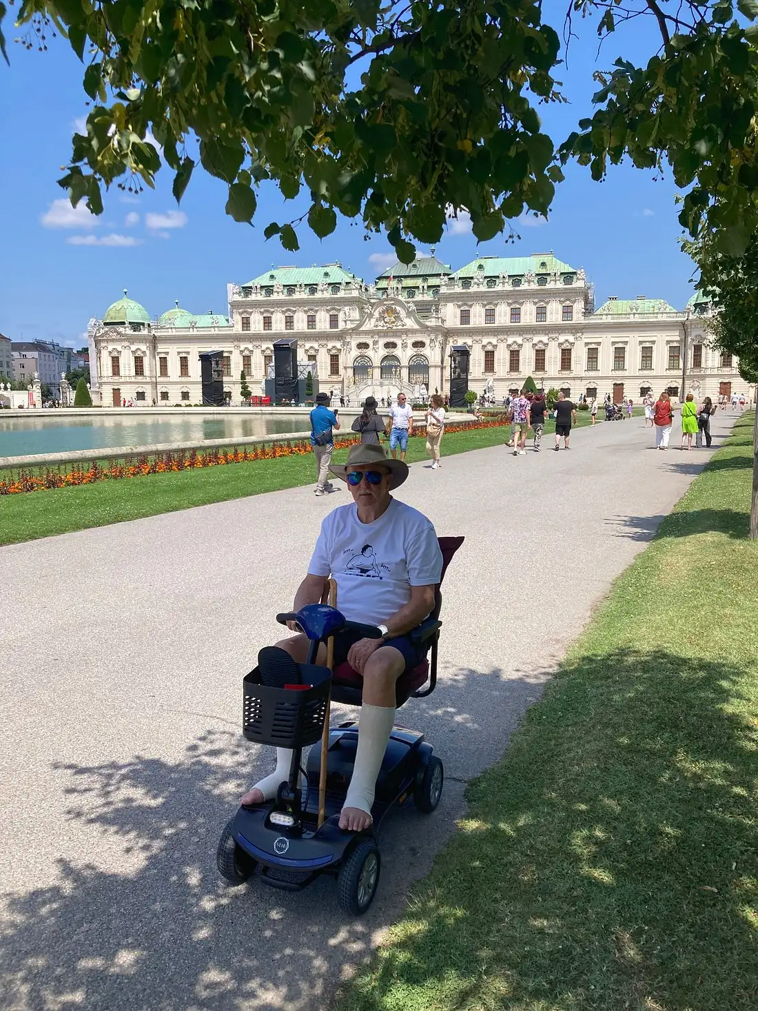A Mobile4Ever guest in the Belvedere gardens with a Classic+ mobility scooter