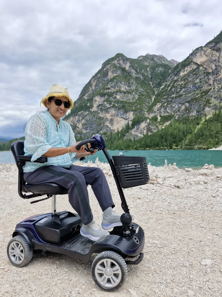 Mobile4Ever customer on a mobility scooter at Alpine lake escape
