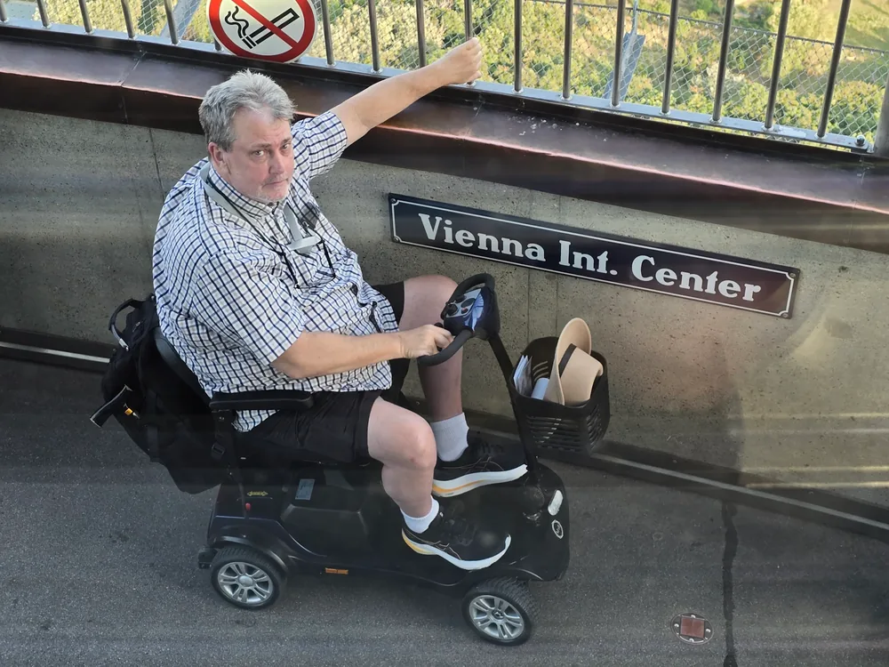 Mobile4Ever customer on a mobility scooter at Vienna Int. Center