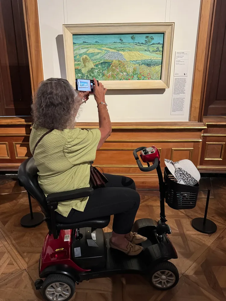 Mobile4Ever customer on a mobility scooter at Van Gogh, Vienna museum